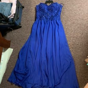 Long blue prom dress with sweetheart neckline and detailed top